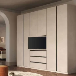 Armadio 6 ante battenti Cashmere con 3 cassetti Vano TV girevole e maniglie a gola disponibile in 3 colori