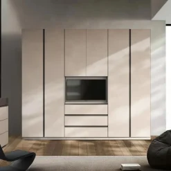 Armadio 6 ante battenti Cashmere con 3 cassetti Vano TV girevole e maniglie a gola disponibile in 3 colori