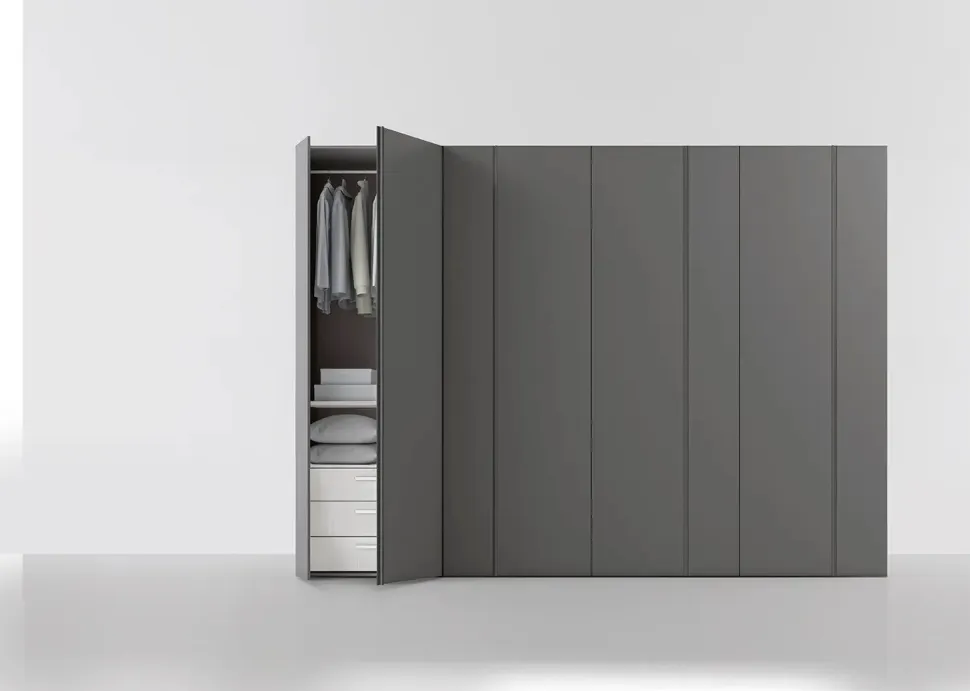 Armadio battente componibile con maniglia a gola e anta asimmetrica disponibile in 12 misure e vari colori