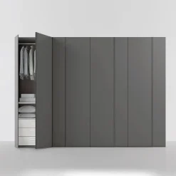 Armadio battente componibile con maniglia a gola e anta asimmetrica disponibile in 12 misure e vari colori