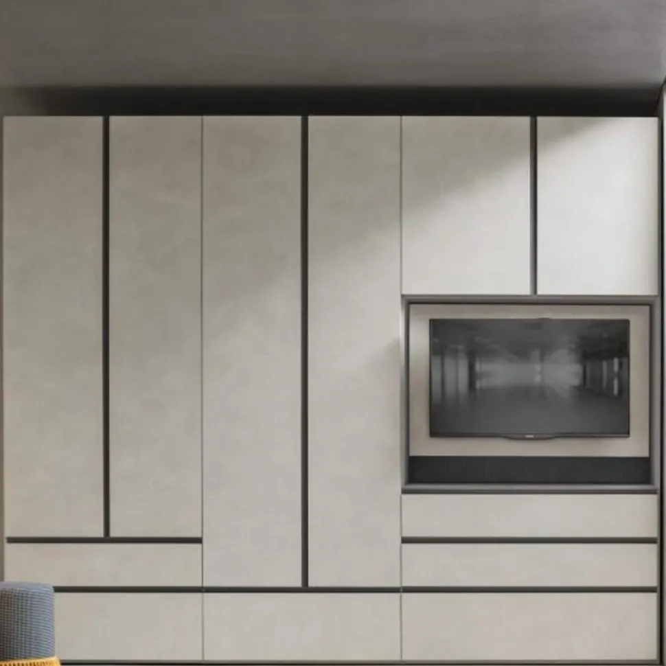 Armadio modulare componibile con vano TV girevole ante battenti e cassetti con maniglia a gola integrata tutta altezza disponibile in vari colori