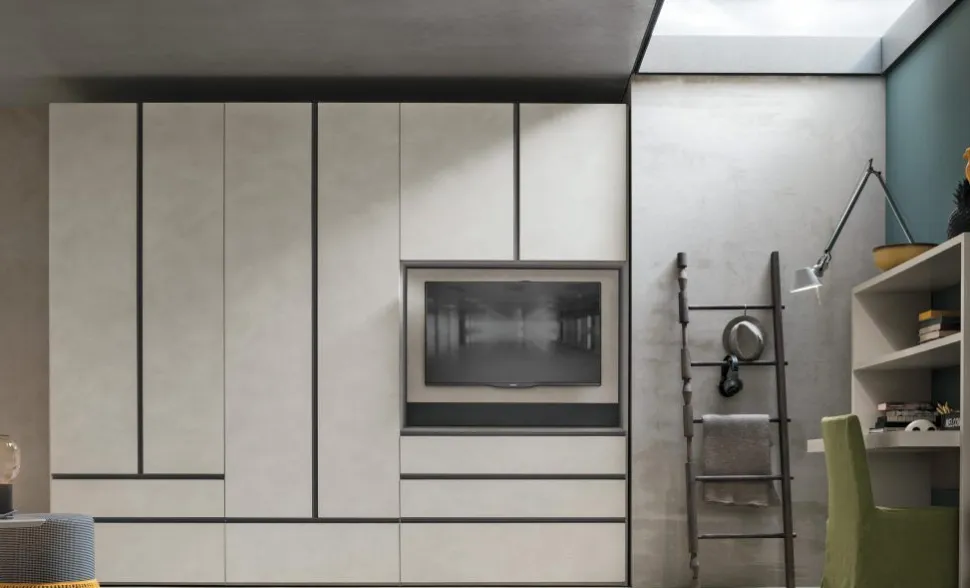 Armadio modulare componibile con vano TV girevole ante battenti e cassetti con maniglia a gola integrata tutta altezza disponibile in vari colori