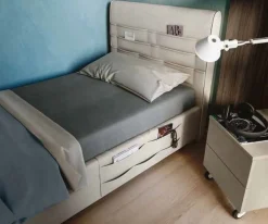 Letto contenitore singolo Blu imbottito con testiera contenitiva disponibile in vari colori e misure