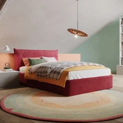 Letto contenitore una piazza e mezzo Nadine imbottito in tessuto linea Colorfull