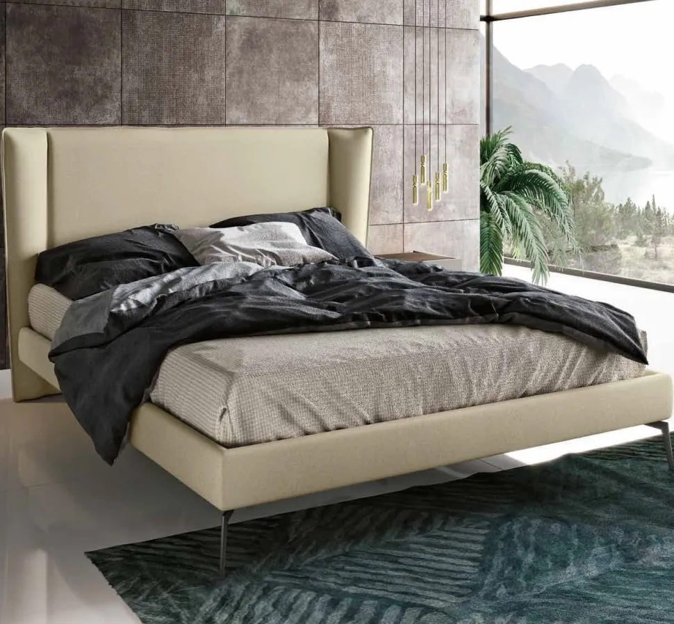 Letto matrimoniale imbottito in tessuto con piedini in ferro disponibile in vari colori