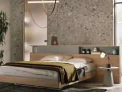 Letto matrimoniale moderno con testiera con vani contenitore disponibile in vari colori