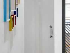 Maniglie curve con rosette di diametro 50 mm per porte scorrevoli